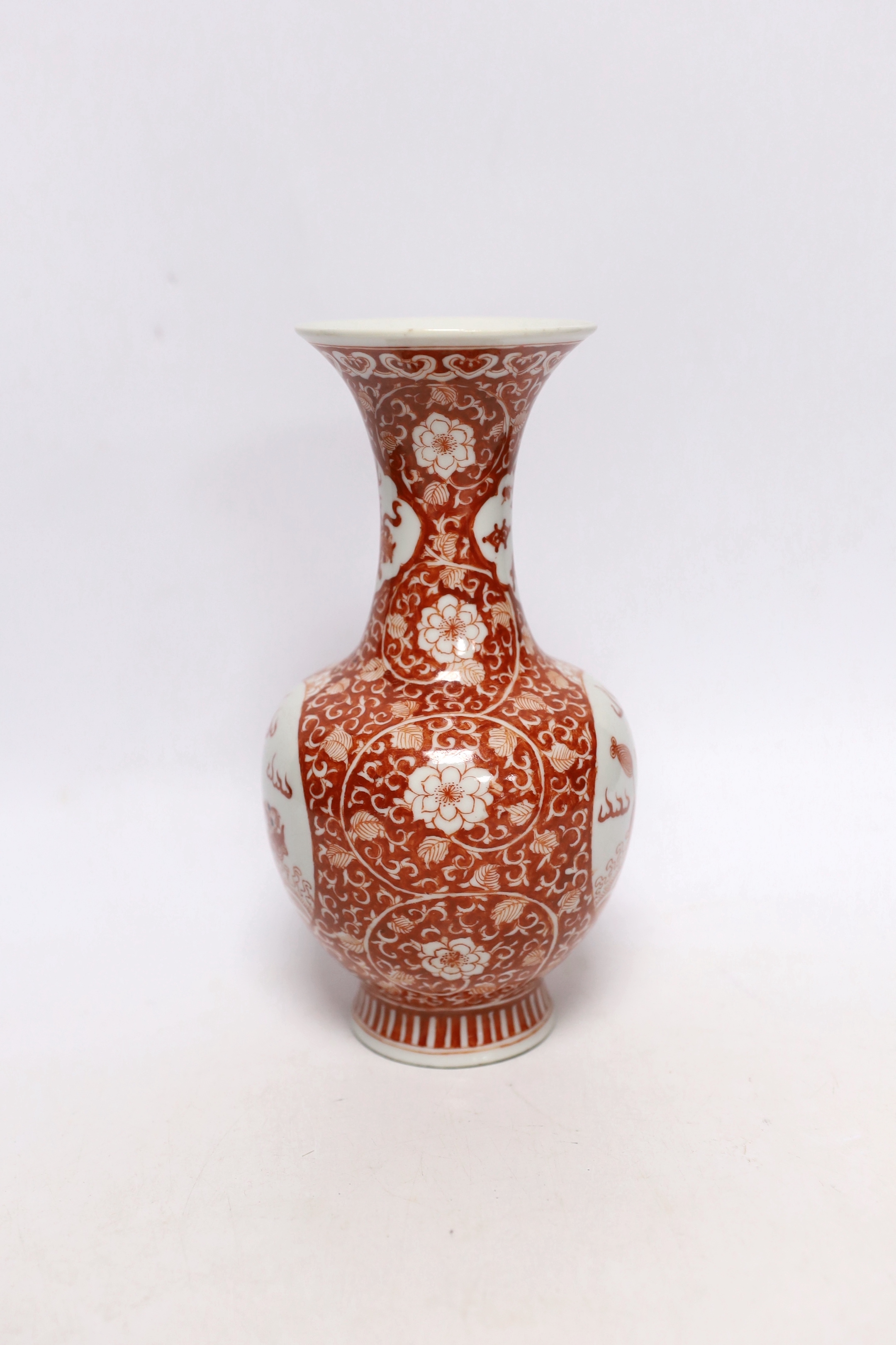 A Chinese iron red enamelled 'mythical beast' vase, early 20th century, 21cm high